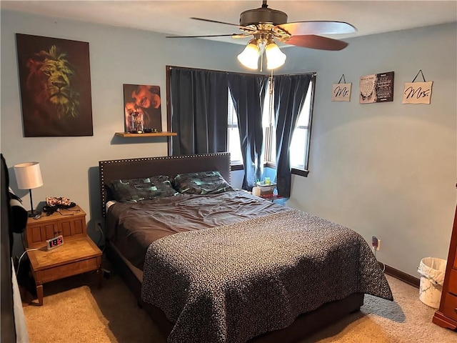 bedroom with carpet flooring, baseboards, and ceiling fan