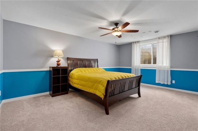 bedroom with baseboards, carpet floors, and ceiling fan