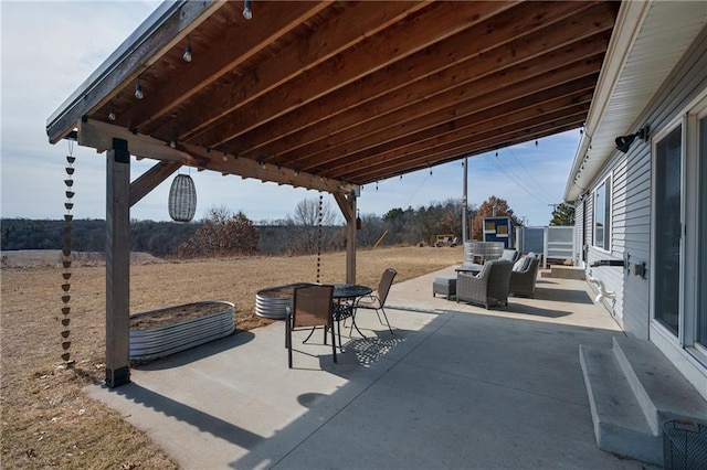 view of patio featuring outdoor dining area