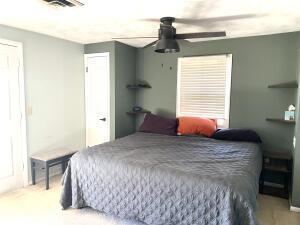 bedroom featuring visible vents and a ceiling fan