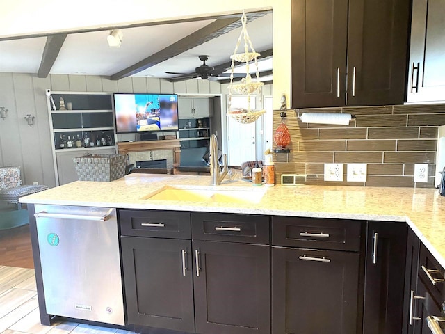 kitchen featuring backsplash, beam ceiling, a peninsula, stainless steel dishwasher, and a sink