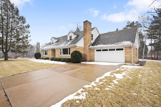 view of front of property featuring roof with shingles, concrete driveway, a front yard, an attached garage, and a chimney