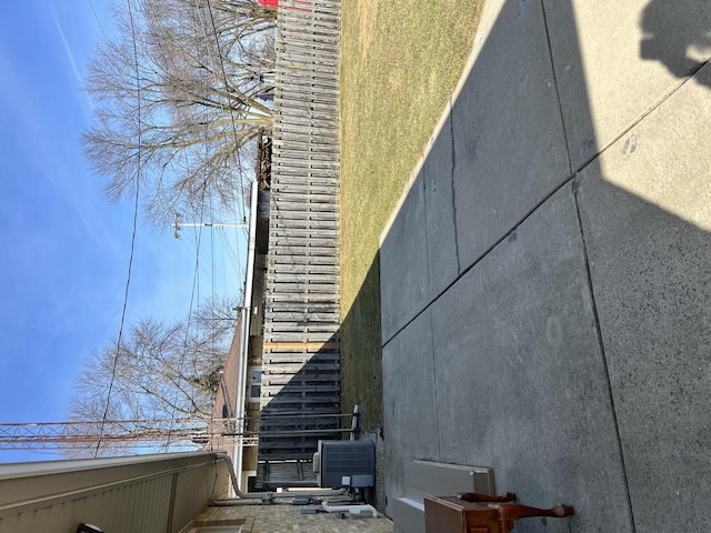 view of side of home featuring a balcony