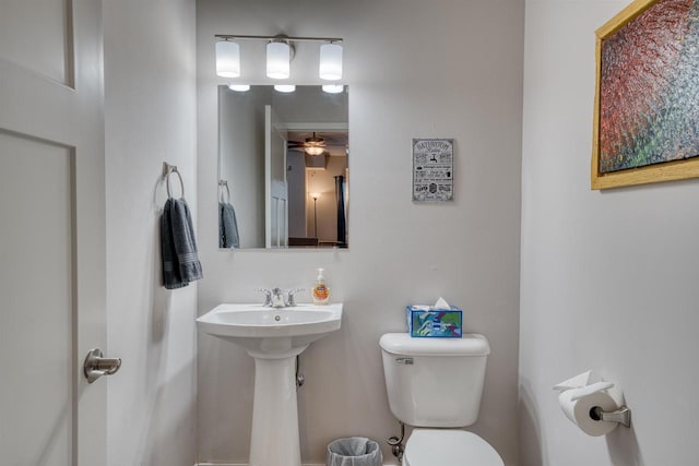 half bathroom with a sink and toilet