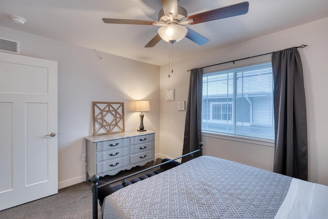 bedroom with carpet, baseboards, visible vents, and a ceiling fan