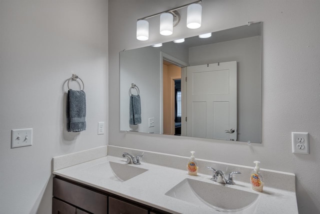 bathroom with double vanity and a sink