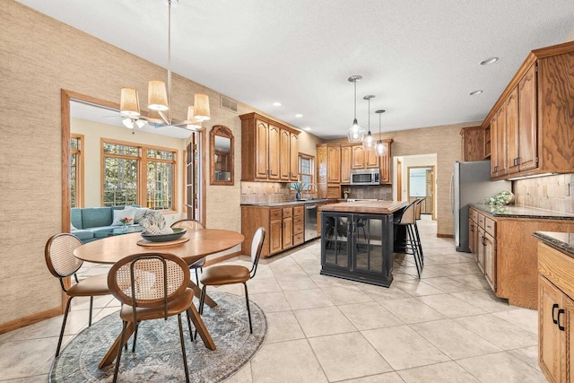 dining space featuring light tile patterned floors, a ceiling fan, visible vents, baseboards, and recessed lighting