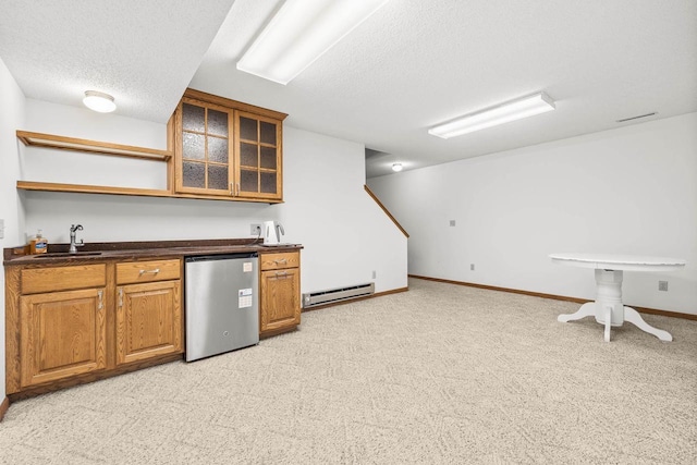 bar featuring a baseboard heating unit, wet bar, refrigerator, a textured ceiling, and a sink