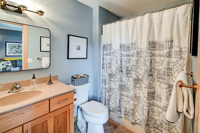 bathroom featuring vanity and toilet