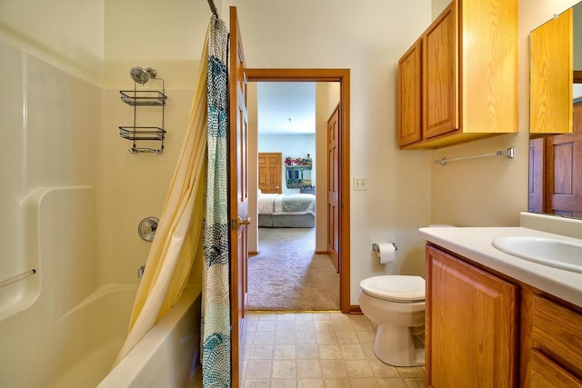 bathroom with vanity, baseboards, shower / bath combination with curtain, tile patterned floors, and toilet