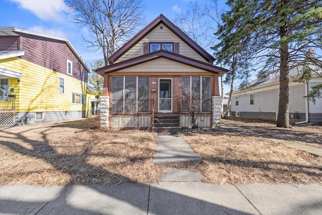 view of front of house with a sunroom