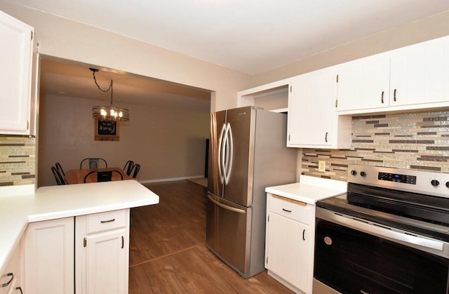 kitchen featuring light countertops, white cabinets, wood finished floors, and appliances with stainless steel finishes