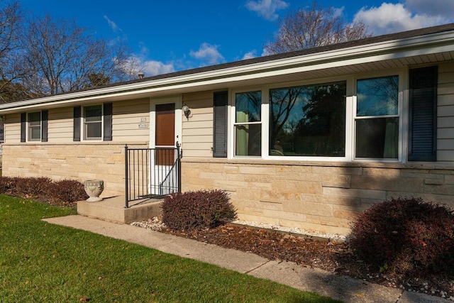 single story home with stone siding