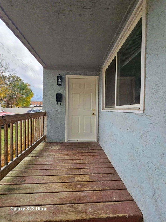 entrance to property with stucco siding