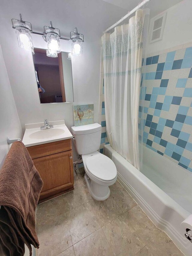 full bathroom featuring visible vents, toilet, vanity, and shower / bath combo