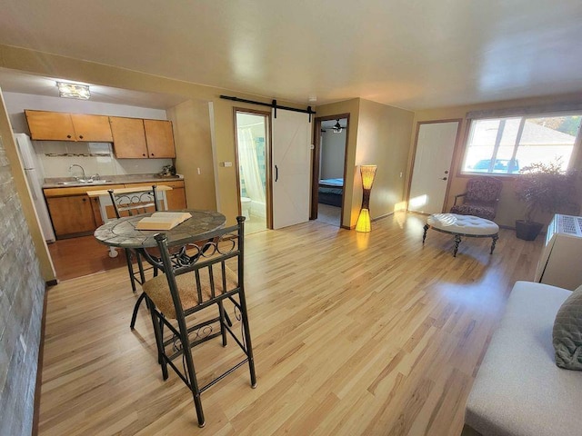 interior space featuring a barn door and light wood-style flooring