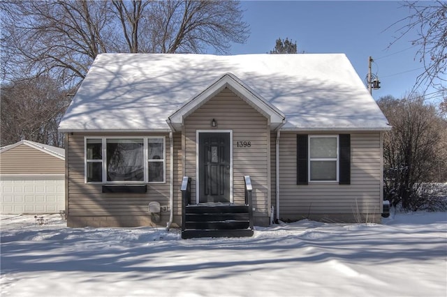 view of front of property with an outbuilding and a garage