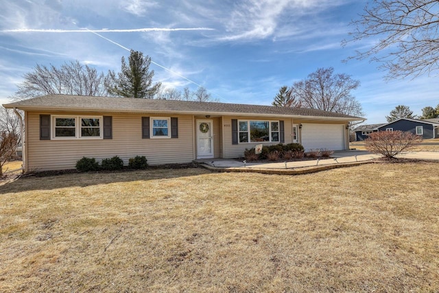 single story home with driveway, a front lawn, and a garage