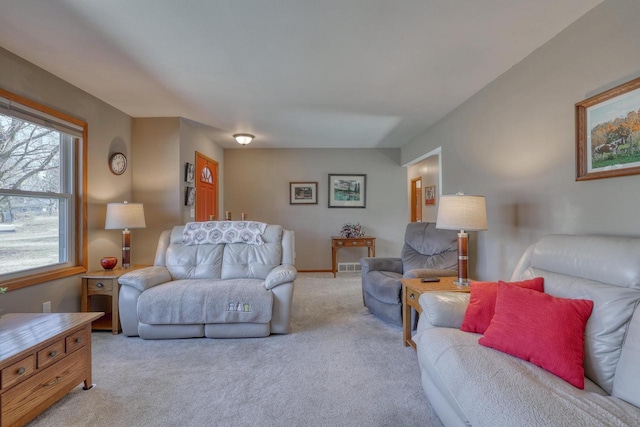 carpeted living room featuring visible vents