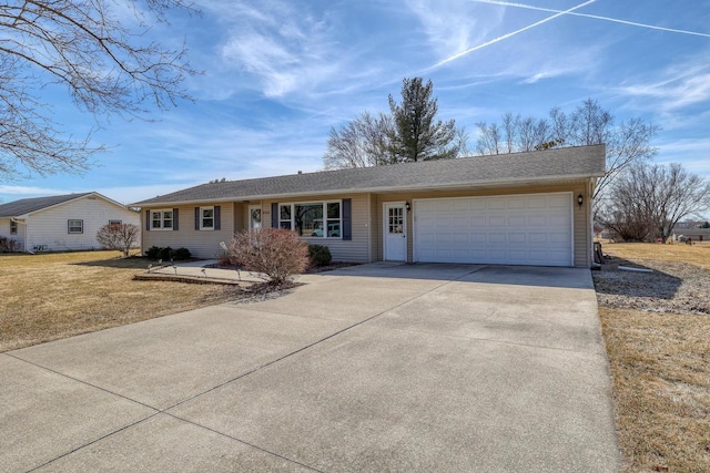 ranch-style home with an attached garage, driveway, and a front yard