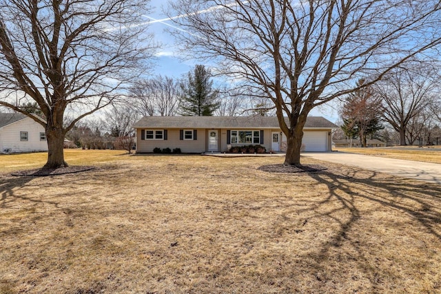 ranch-style home with a front lawn, an attached garage, and driveway