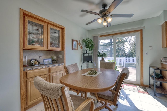 dining room featuring ceiling fan and light tile patterned flooring