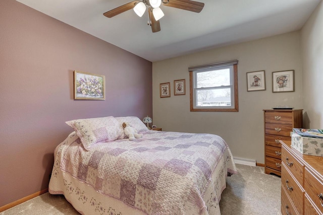 carpeted bedroom featuring ceiling fan, baseboards, and a baseboard radiator