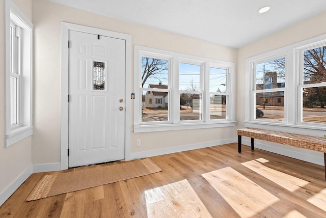 entrance foyer with recessed lighting, baseboards, and light wood finished floors