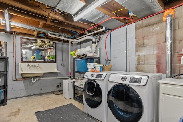 clothes washing area with independent washer and dryer and laundry area