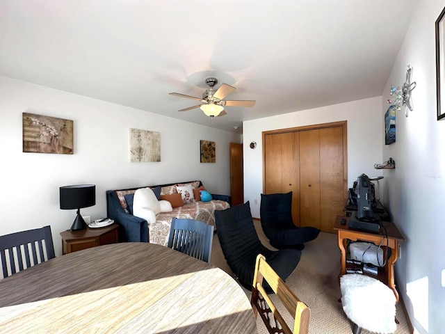 bedroom featuring a closet, ceiling fan, and carpet flooring