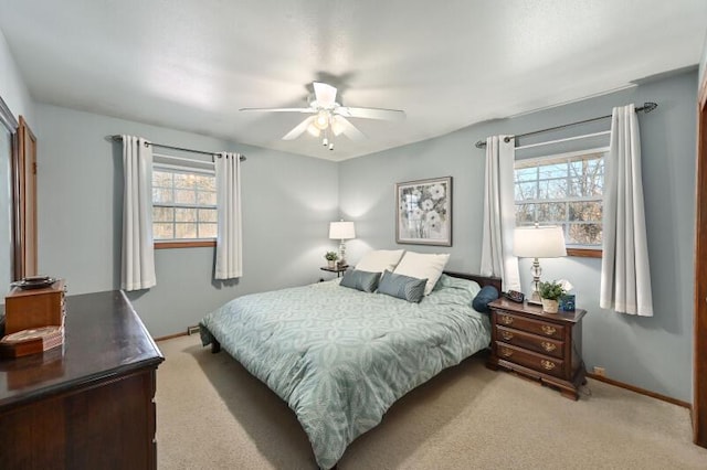 bedroom featuring baseboards, carpet floors, and ceiling fan