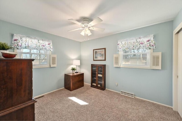 bedroom featuring baseboards, visible vents, carpet floors, and ceiling fan