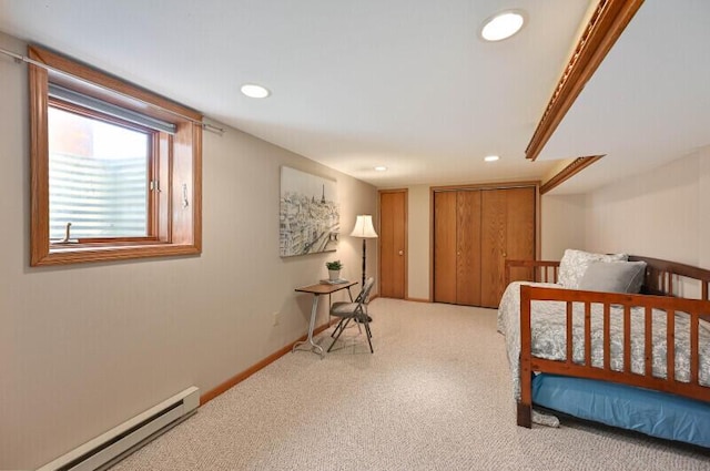 bedroom with recessed lighting, carpet, baseboards, and baseboard heating