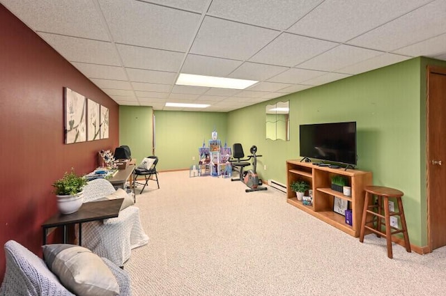 game room featuring a drop ceiling, baseboards, carpet floors, and a baseboard radiator