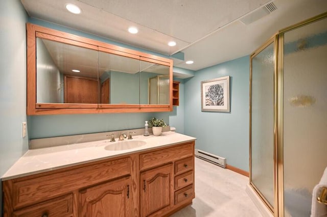 bathroom with recessed lighting, a baseboard heating unit, vanity, and a shower stall