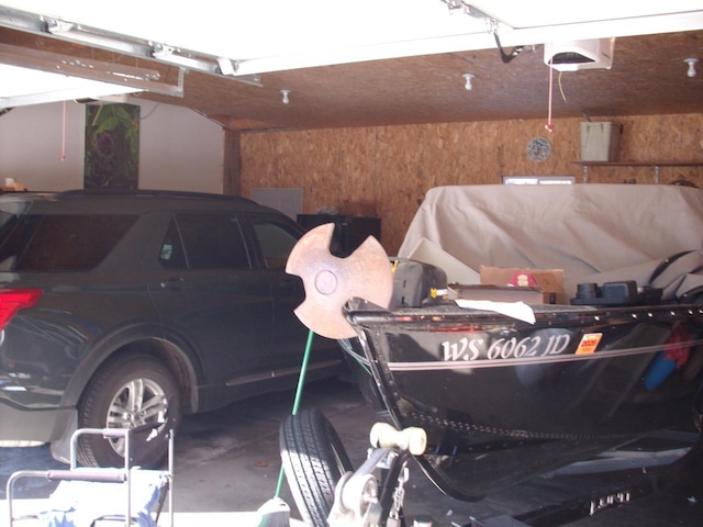 garage featuring wood walls