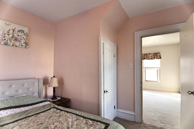 bedroom featuring baseboards and carpet floors