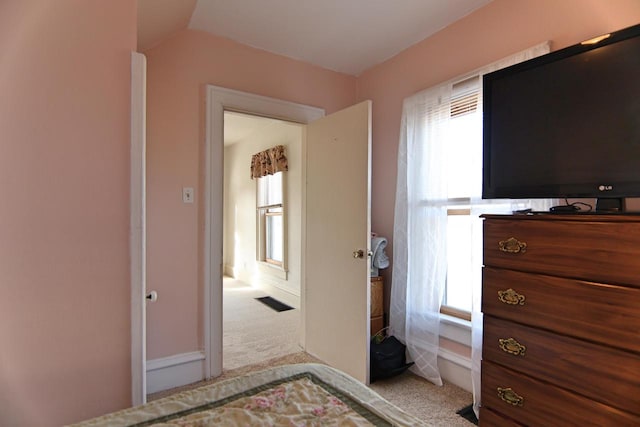 carpeted bedroom featuring vaulted ceiling