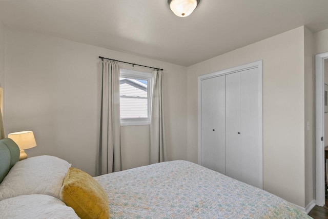 bedroom featuring a closet and baseboards