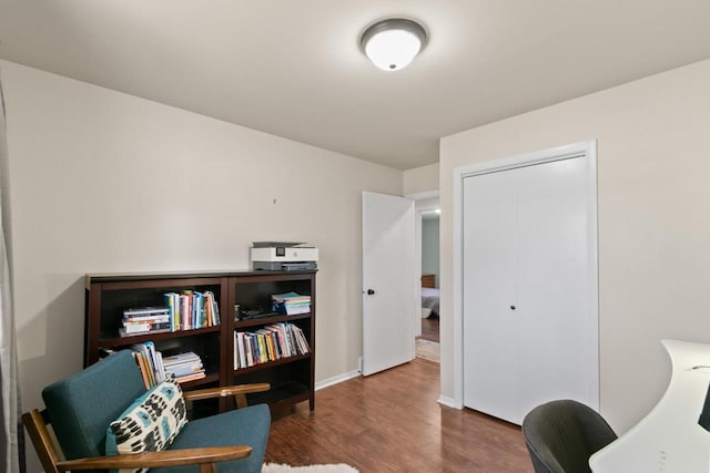 home office featuring baseboards and wood finished floors