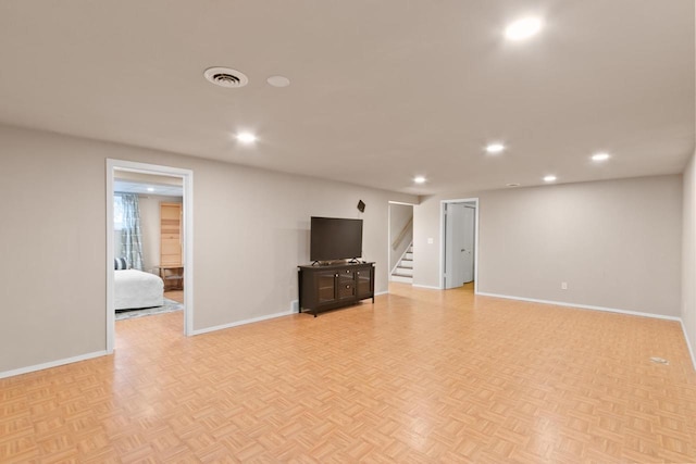 unfurnished living room featuring stairs, recessed lighting, baseboards, and visible vents