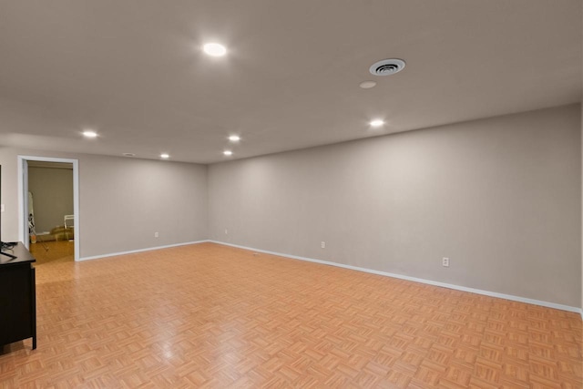 below grade area with recessed lighting, visible vents, and baseboards