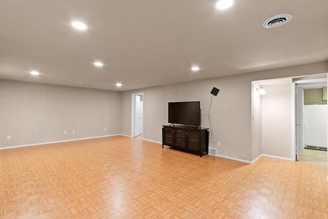 interior space featuring recessed lighting, baseboards, and visible vents