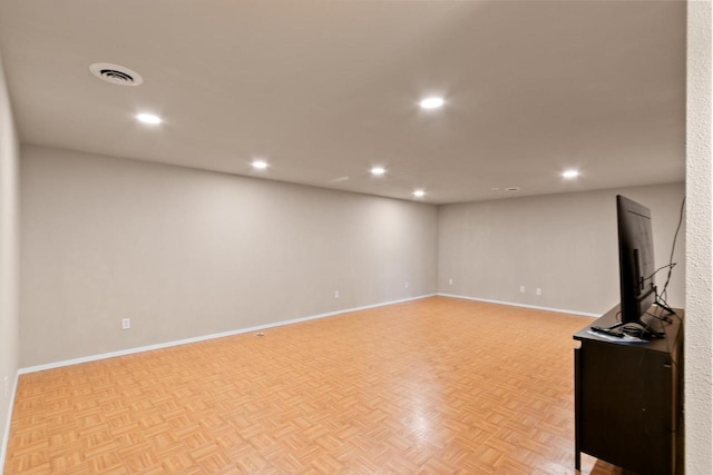 basement with recessed lighting, visible vents, and baseboards