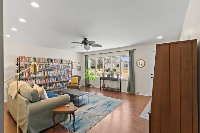 sitting room with recessed lighting, baseboards, ceiling fan, and wood finished floors