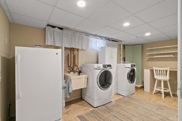 washroom with washer and clothes dryer, laundry area, recessed lighting, and a sink