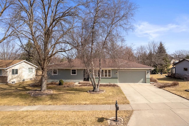 ranch-style house with a garage, a front yard, and driveway