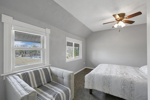 carpeted bedroom with baseboards, ceiling fan, and vaulted ceiling