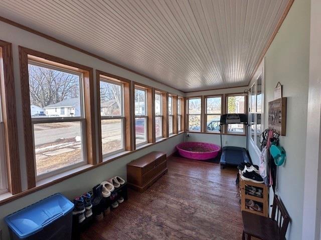 sunroom / solarium featuring wood ceiling