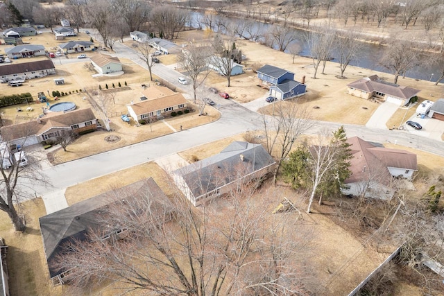 bird's eye view with a residential view and a water view